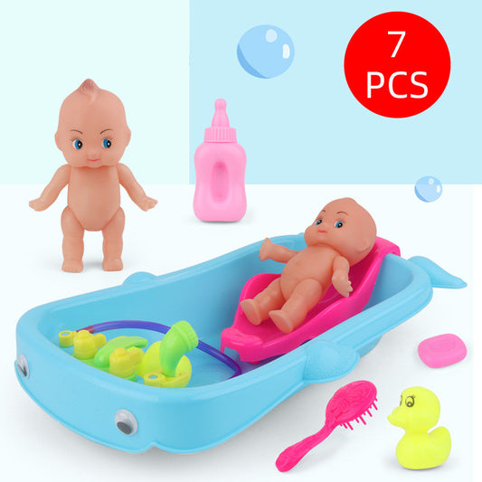 Baby Playing In Water Tub With Bath Toys